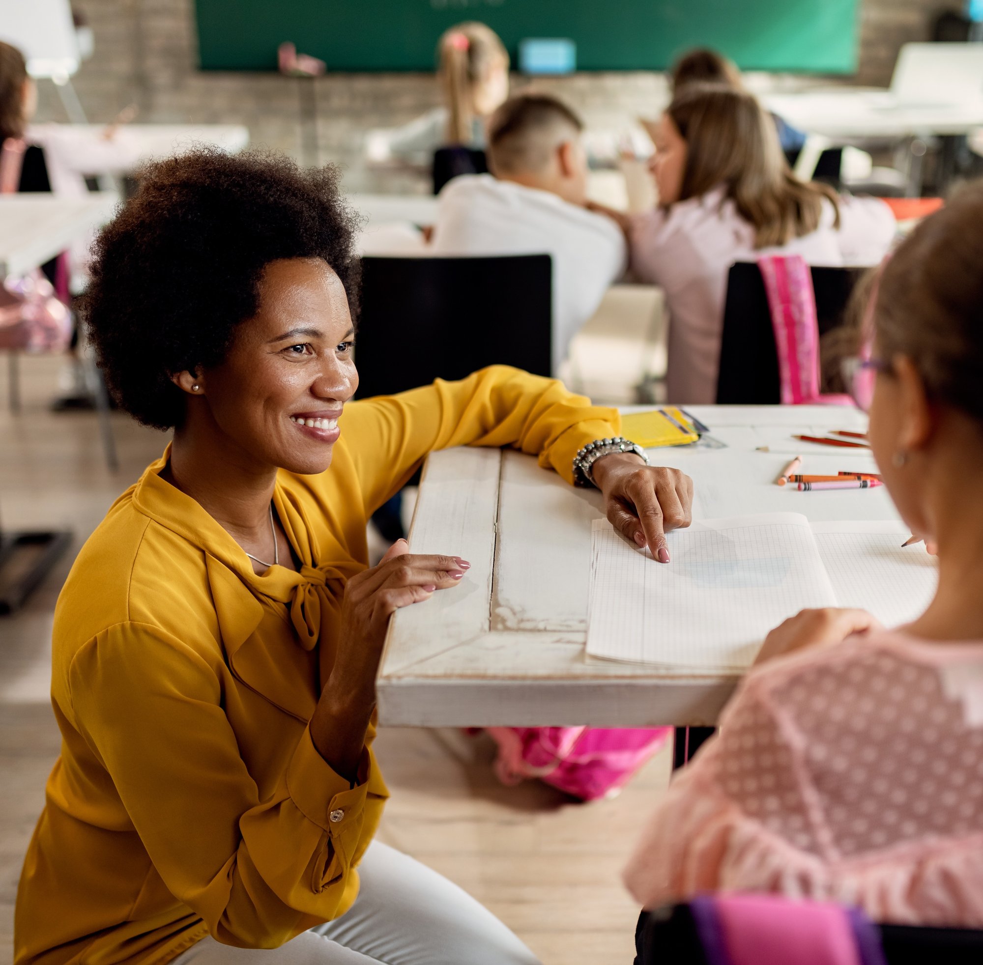 UDL Now! Embrace Inclusion, Ignite Potential - Image of Teacher working with Student