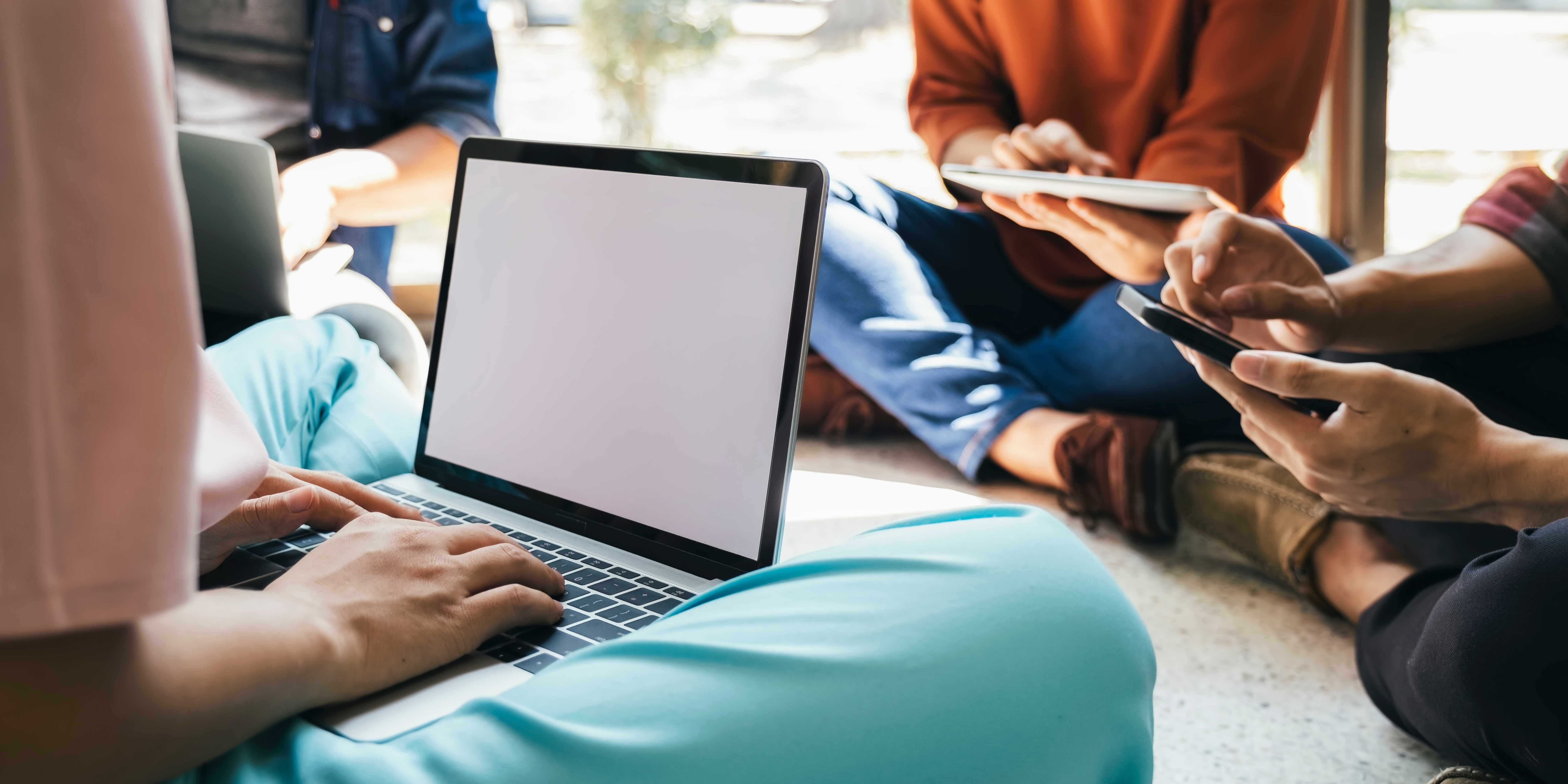 students on computer and phone