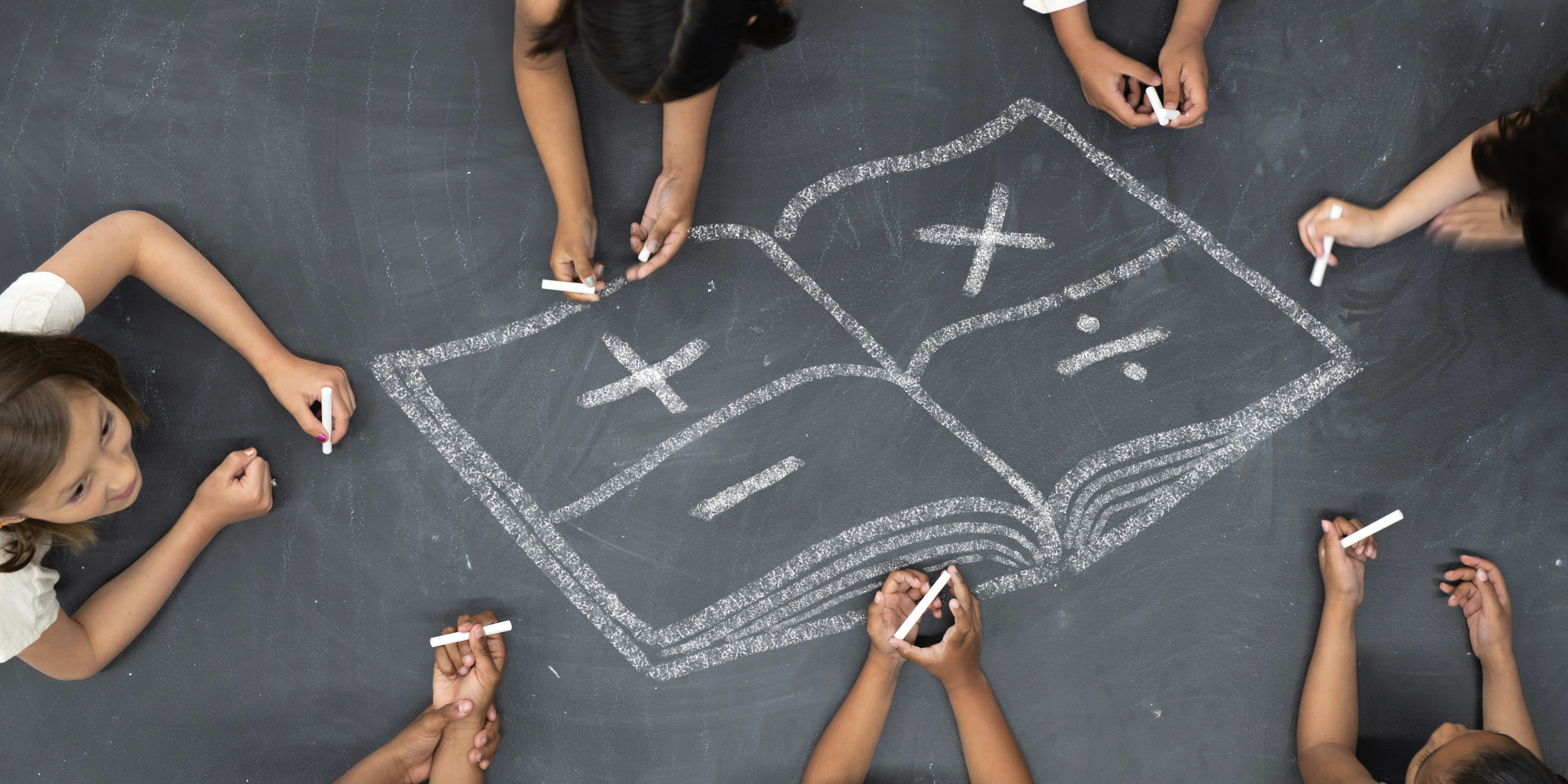 students drawing with chalk - math symbols