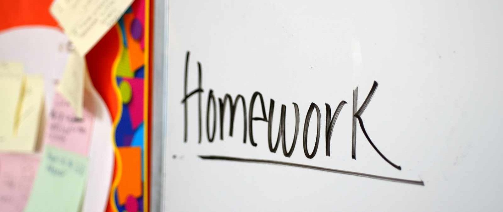 Homework written on white board