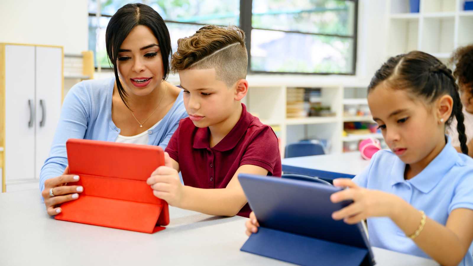 students interacting with tech tools