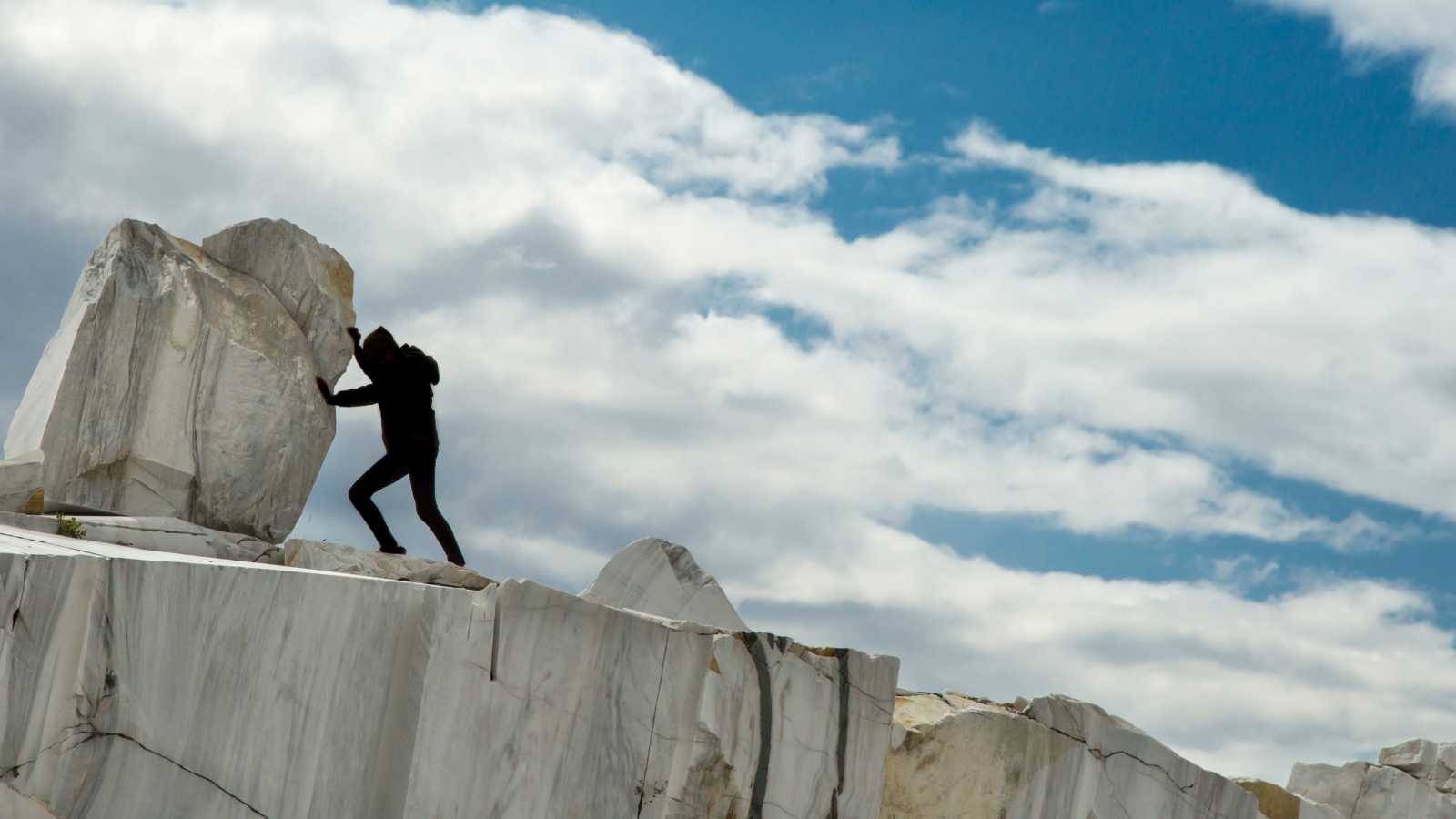 rolling a rock up a hill